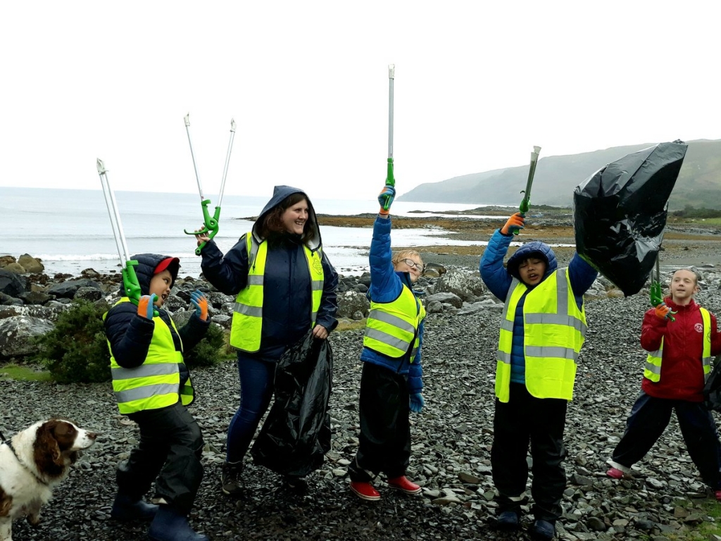 Wave your litter pickers in the air. The children of Lochdonhead school at the Great British Beach Clean